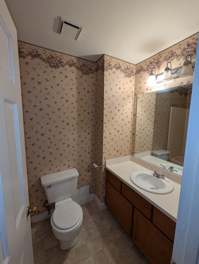 bathroom with vanity and toilet