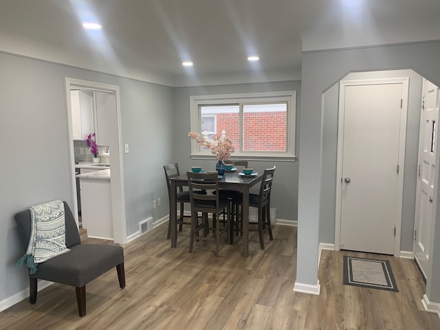 dining space featuring light wood-type flooring