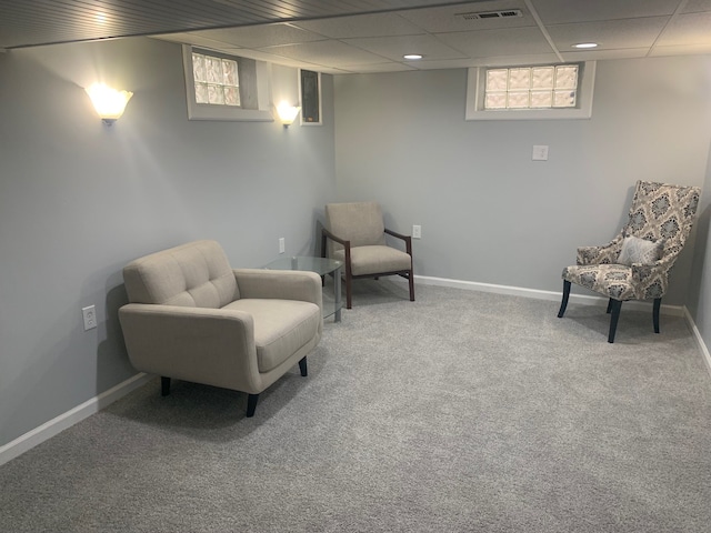 living area featuring carpet flooring