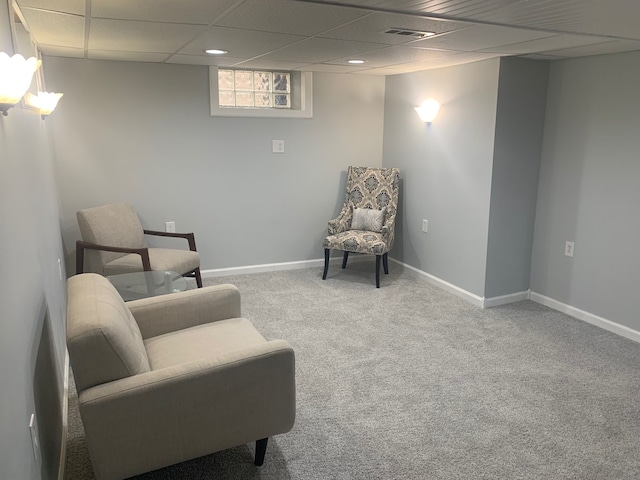 sitting room featuring carpet flooring