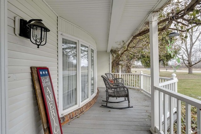 wooden terrace featuring a porch