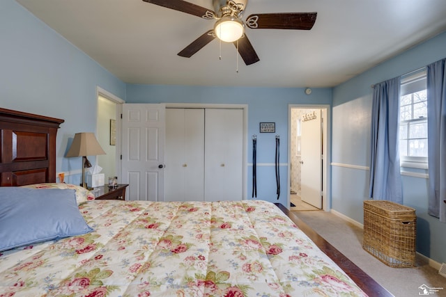 carpeted bedroom with ceiling fan and a closet