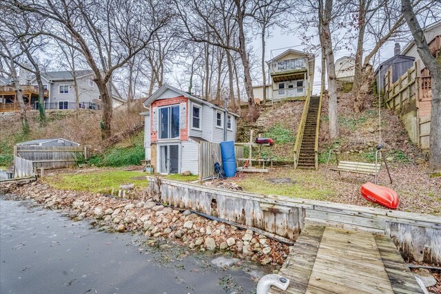 rear view of house with an outdoor structure