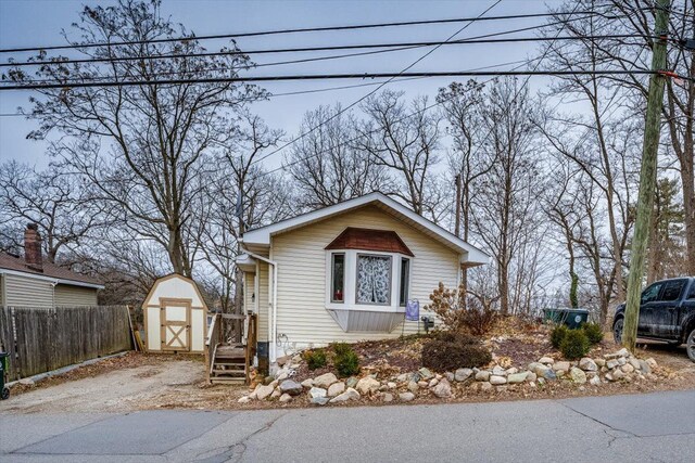 view of home's exterior featuring a storage shed