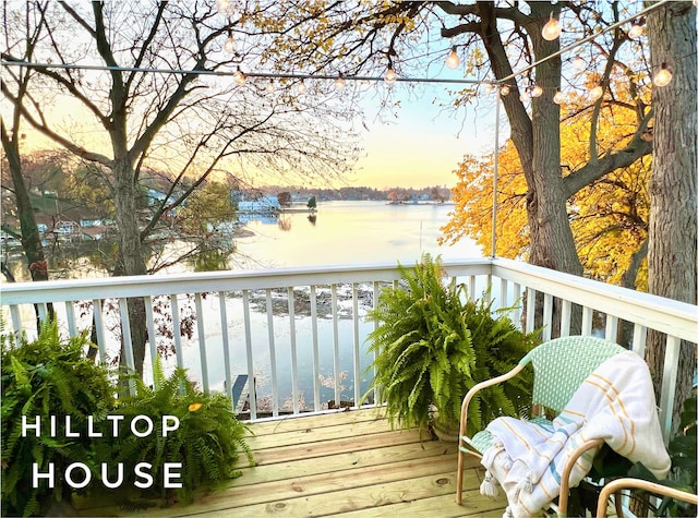 wooden deck with a water view