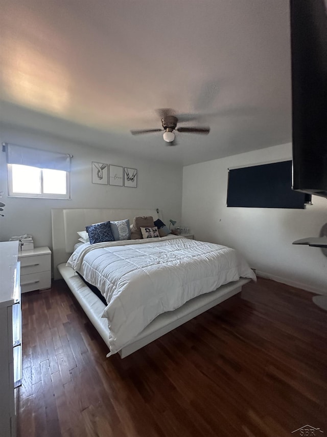 bedroom featuring dark wood-type flooring and ceiling fan