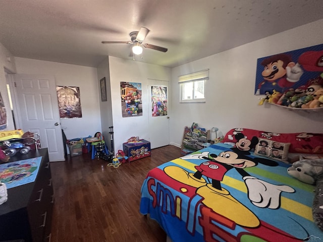 bedroom featuring dark hardwood / wood-style floors and ceiling fan