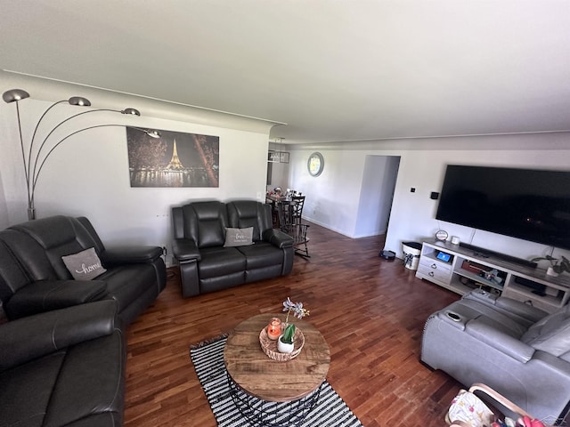 living room with dark hardwood / wood-style flooring