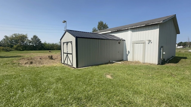 view of outbuilding with a lawn