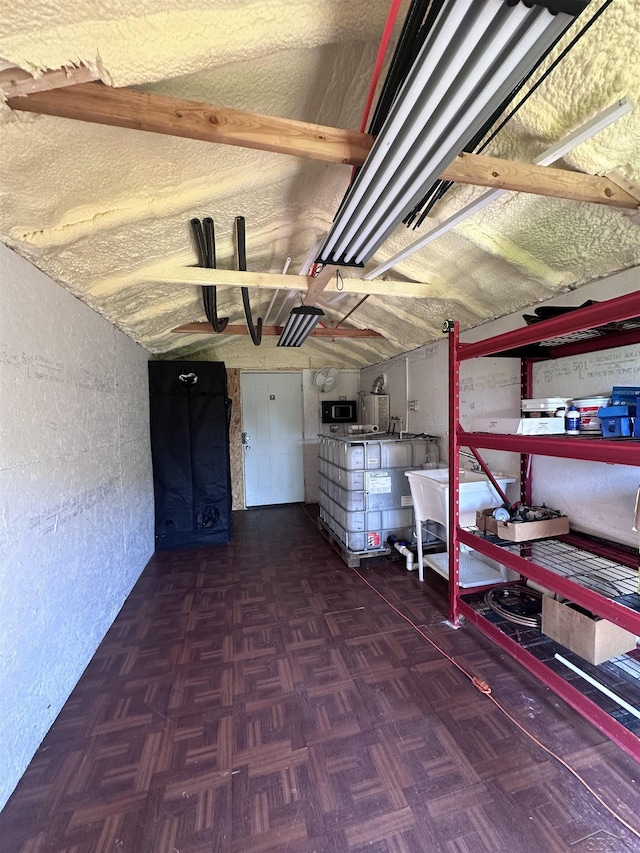 basement featuring dark parquet flooring