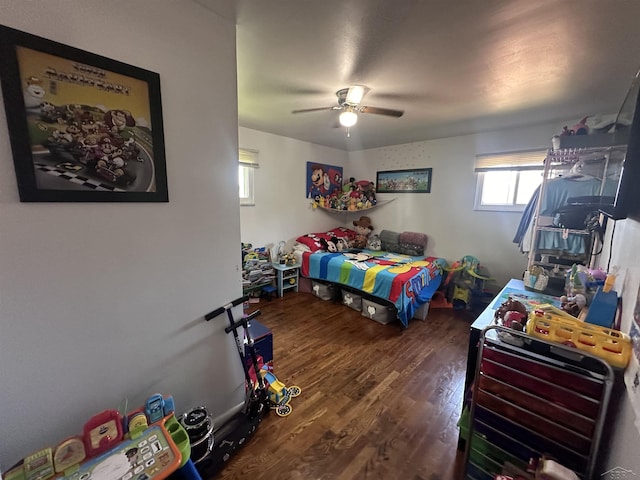 bedroom featuring dark hardwood / wood-style floors and ceiling fan