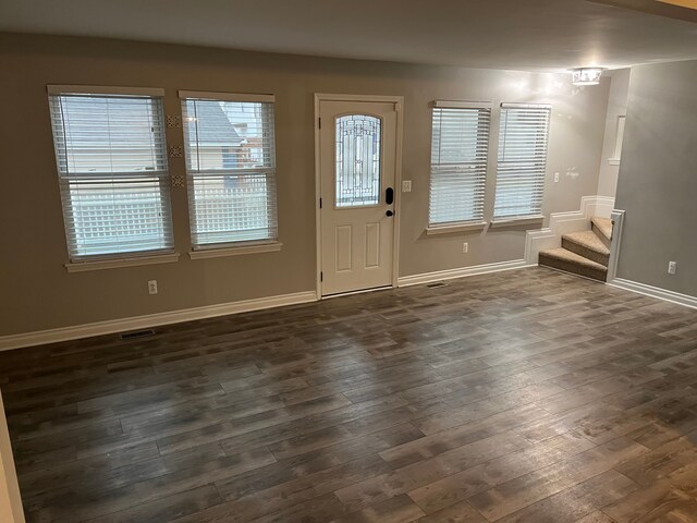 entrance foyer featuring dark hardwood / wood-style floors