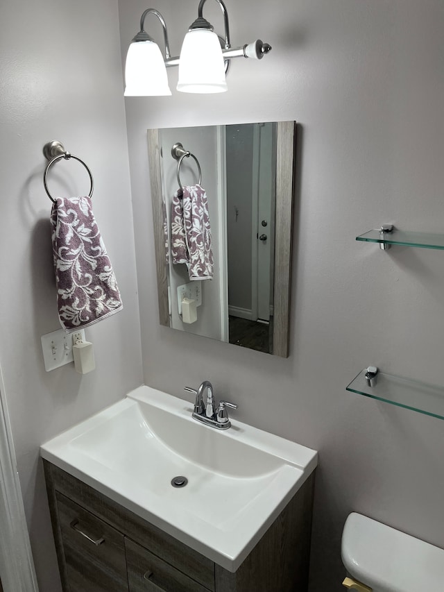 bathroom with vanity and toilet