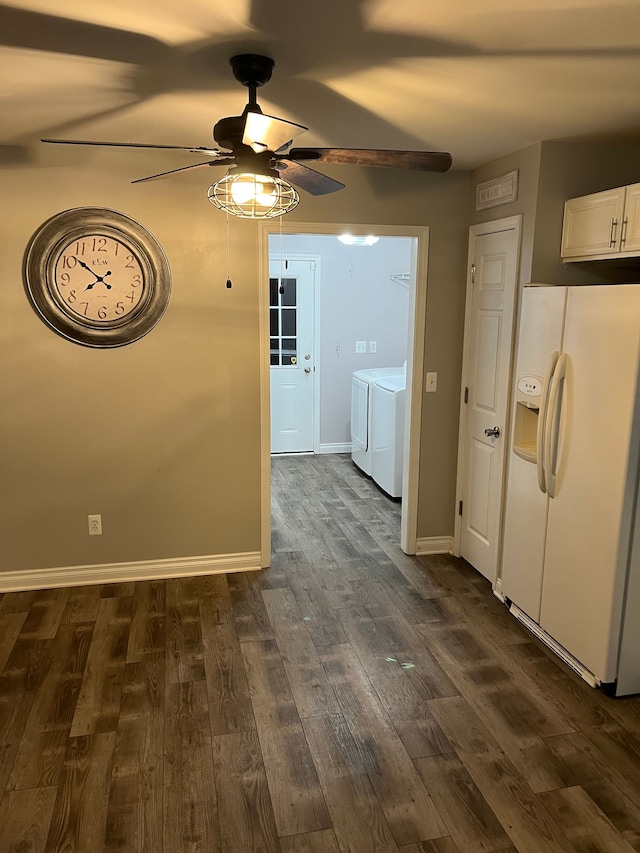 interior space with washer and clothes dryer, ceiling fan, and dark hardwood / wood-style flooring