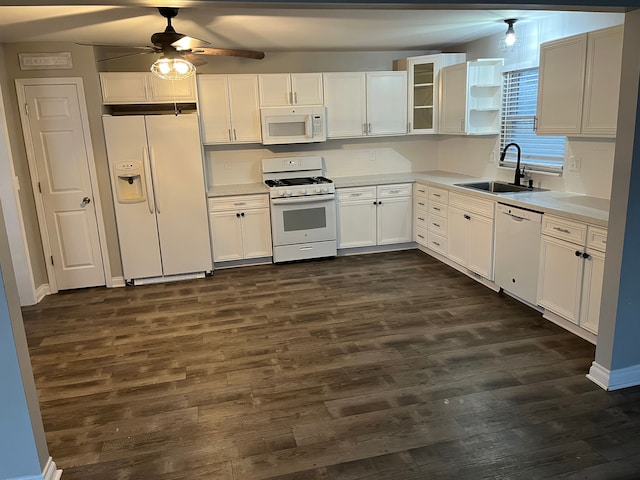 kitchen with sink, white appliances, dark wood-type flooring, ceiling fan, and white cabinets