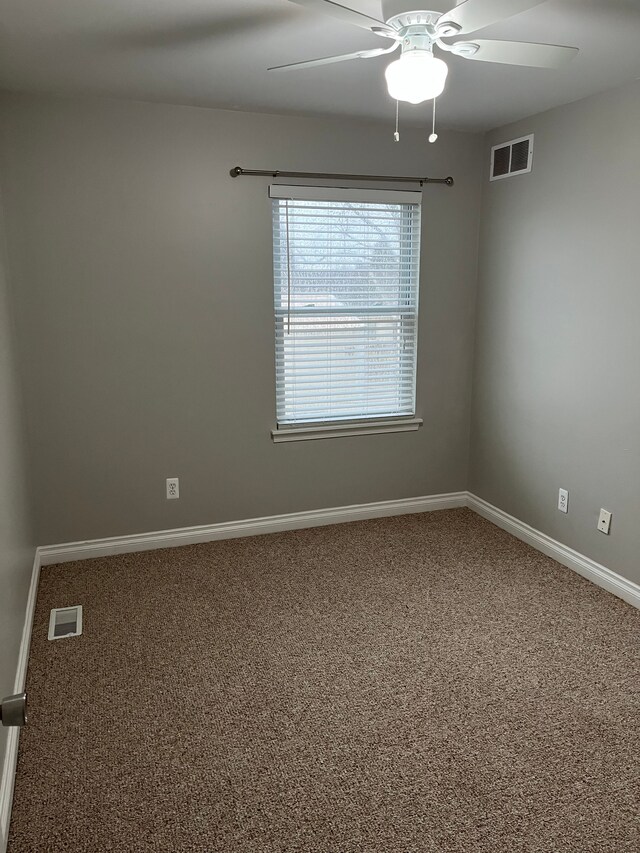 unfurnished room featuring carpet floors and ceiling fan