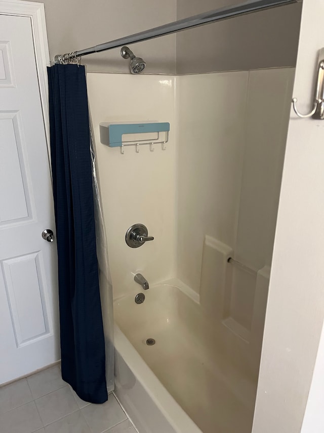 bathroom with tile patterned flooring and shower / bath combination with curtain