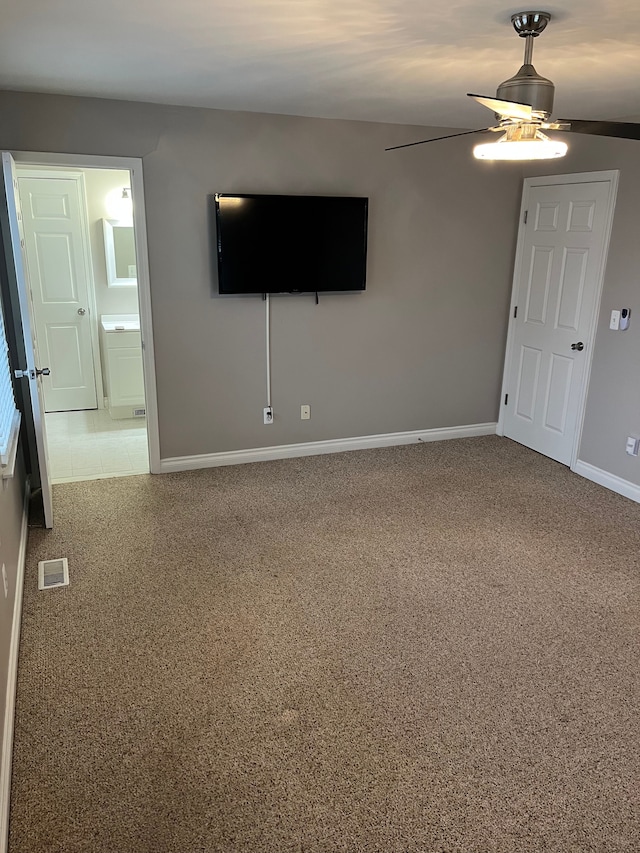 spare room with carpet flooring and ceiling fan