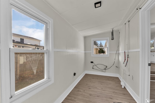 clothes washing area featuring light hardwood / wood-style flooring