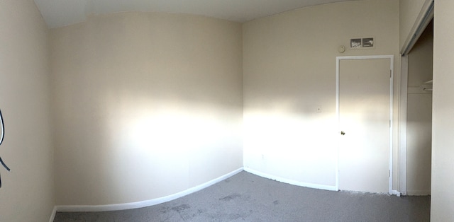 unfurnished room featuring carpet