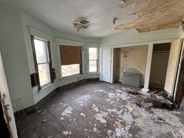 interior space with a textured ceiling