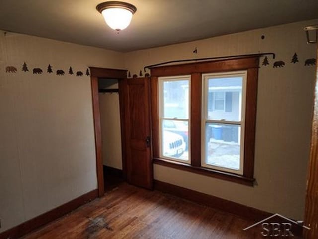 empty room featuring dark hardwood / wood-style floors