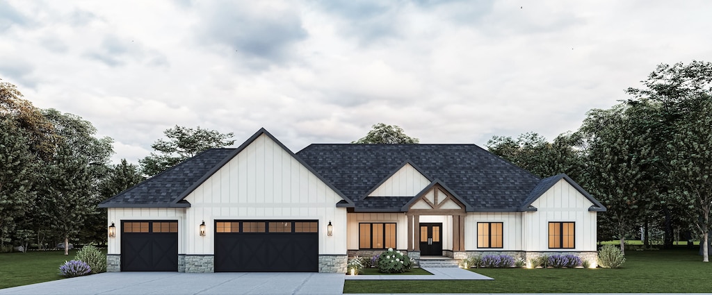 view of front of house featuring a garage and a front yard