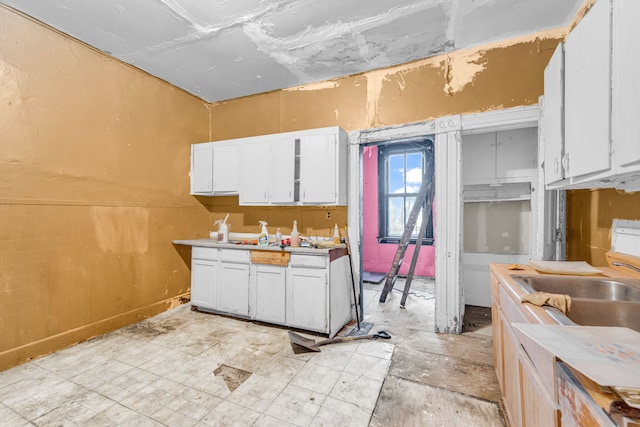 kitchen featuring white cabinets