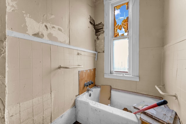 bathroom featuring a tub to relax in