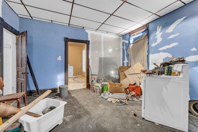 interior space featuring washer / clothes dryer and a drop ceiling