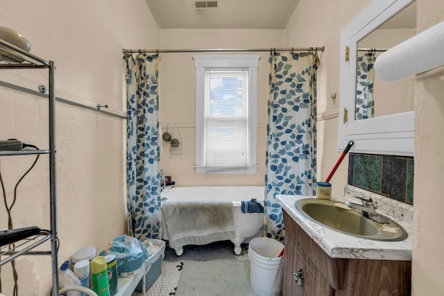 bathroom with tile patterned flooring, vanity, and shower with separate bathtub