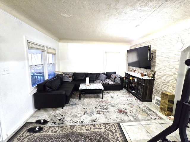 living room with light tile patterned floors and a textured ceiling