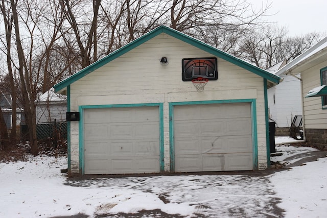 view of snow covered garage