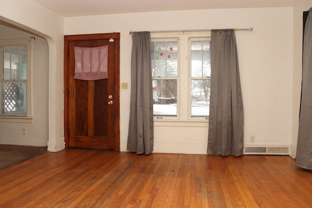 foyer featuring dark wood-type flooring