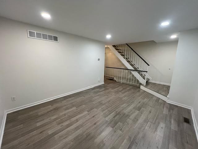 basement featuring dark wood-type flooring