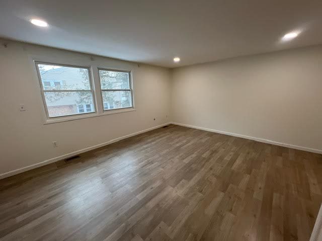 1622 Brentwood Dr, Troy, MI 48098 - spare room featuring healthy amount of natural light, baseboards, and recessed lighting