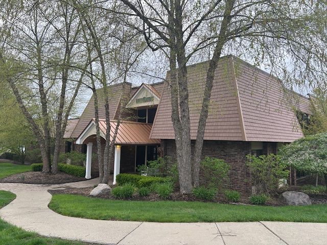 1622 Brentwood Dr, Troy, MI 48098 - view of front of home with brick siding and mansard roof