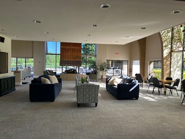 1622 Brentwood Dr, Troy, MI 48098 - living room with light carpet, recessed lighting, and expansive windows