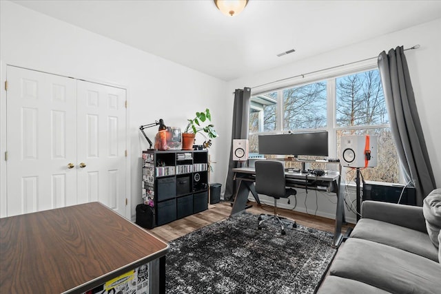 office area with hardwood / wood-style floors