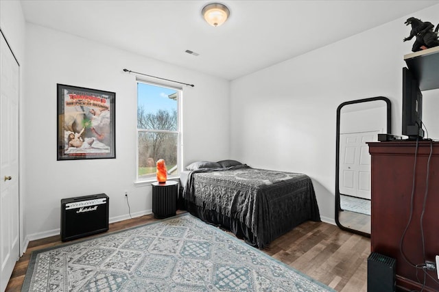 bedroom with wood-type flooring