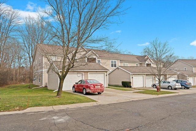 view of front of house with a front lawn and a garage