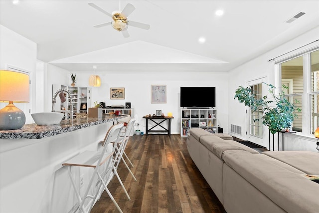 living room with ceiling fan, dark hardwood / wood-style flooring, and lofted ceiling