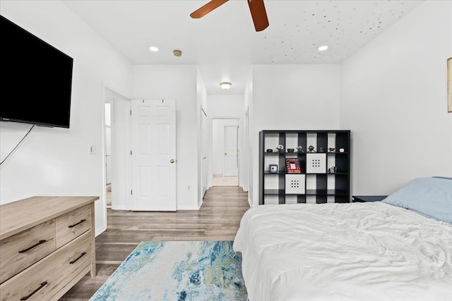 bedroom featuring ceiling fan and dark wood-type flooring