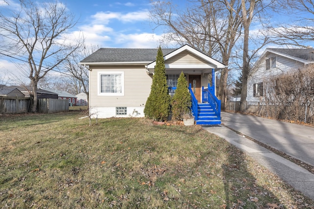 bungalow-style home with covered porch and a front lawn