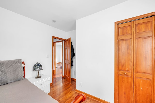 bedroom with light hardwood / wood-style floors