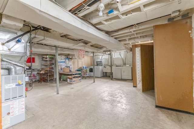 basement with independent washer and dryer and sink