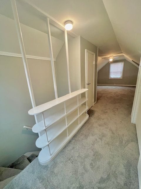 bonus room with carpet floors and lofted ceiling