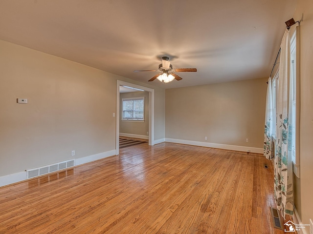 unfurnished room featuring light hardwood / wood-style floors and ceiling fan