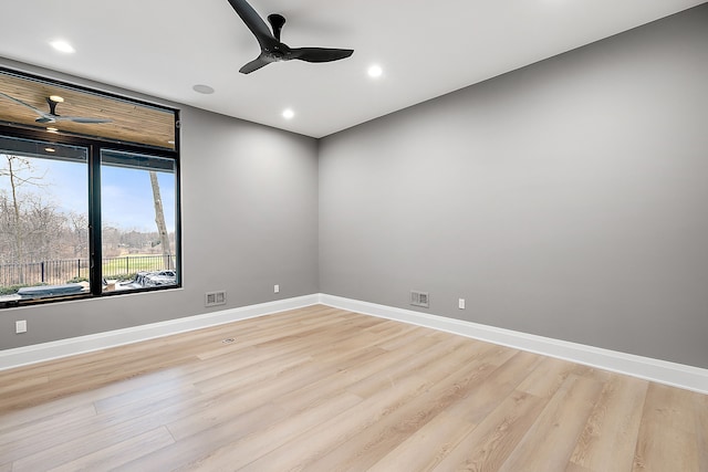 spare room featuring ceiling fan and light wood-type flooring