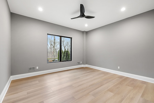 empty room with light hardwood / wood-style flooring and ceiling fan